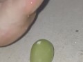 Smashing juicy grapes under my big toes close up under and side pov