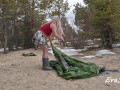 A gorgeous blonde without panties is assembling a tent. For lovers of peeping