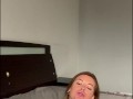 Milf with a big ass caresses herself and plays with a vibrator on the bed