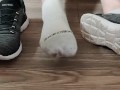 Removing dirty white ankle socks from my dirty and sweaty feet