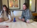 A sexy babe playing connect 4 with her friend on the bed and loses each round