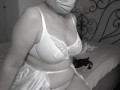 A mature BBW milf tries on bras with big natural saggy tits.