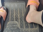 Revving the pedals of my mini Cooper with my pink Adidas slides