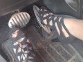 Big feet pedal pumping the gas pedal in strappy sexy black heels