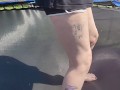 Slow motion jumping on a trampoline in shorts & T-shirt regular woman jumping not a big tit slut