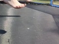 Slow motion jumping on a trampoline in shorts & T-shirt regular woman jumping not a big tit slut