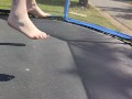 Slow motion jumping on a trampoline in shorts & T-shirt regular woman jumping not a big tit slut