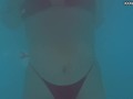 Perfect body brunette enjoys naked swimming