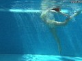 Cute wifey gets naked quickly in the pool