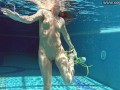 Cute wifey gets naked quickly in the pool
