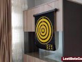 A cute redhead plays strip dart with her friend and loses all rounds