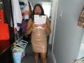 Trying on suntan pantyhose shinny leg in leather dress