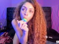 Ginger sucking off her dildo cock