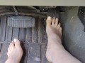 Pedal pumping barefooted in my big truck with white toe nails