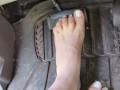 Pedal pumping barefooted in my big truck with white toe nails