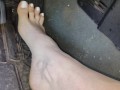 Pedal pumping barefooted in my big truck with white toe nails