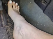 Pedal pumping barefooted in my big truck with white toe nails