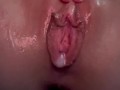 Close up wet pussy cum push out