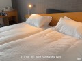 Stepmother shares the hotel bed and her ass with a stepson