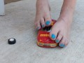 Destroying a model racecar toy with my barefeet smashing it into pieces
