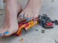 Destroying a model racecar toy with my barefeet smashing it into pieces