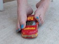 Destroying a model racecar toy with my barefeet smashing it into pieces
