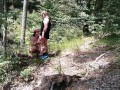 Milf woman with big tits jerking fat dick in the woods