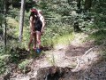 Milf woman with big tits jerking fat dick in the woods
