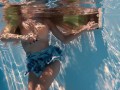 Big boobs blonde babe swimming