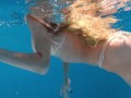 Big boobs blonde babe swimming