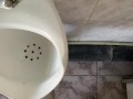 Guy pissing with big uncut cock in public toilet in slow motion POV