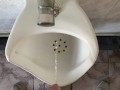 Guy pissing with big uncut cock in public toilet in slow motion POV