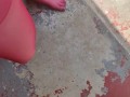 Walking around barefoot wearing red nylon stockings