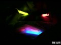 Watch this hot blonde plunge glowsticks in her pussy and ass