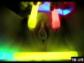 Watch this hot blonde plunge glowsticks in her pussy and ass