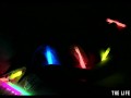 Watch this hot blonde plunge glowsticks in her pussy and ass