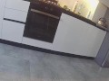 Wife fucks a neighbor in the kitchen. Real cheating