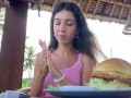 Cute Girl Eating Burger with Cum on Her Face in Public Cafe