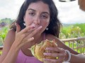 Cute Girl Eating Burger with Cum on Her Face in Public Cafe