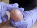 Hot Nurse rubs his cock until he cums on her gloved hands