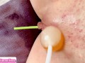 Innocent girl plays with lollipops in her pussy close up