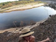 Girl masturbates on the bank of a beautiful river