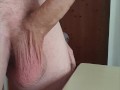 A big cumshot with cum overflowing from the cock