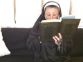 Naughty Nun Smokes a Cigarette Behind Her Bible In Church