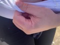 Hand expressing breastmilk at the beach!