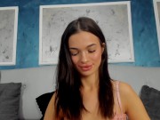 Her intense stare holds an irresistible allure, each slow movement captivating