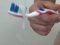 Cleaning their toothbrush