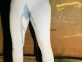 Slut drenches her yoga pants in piss outdoors