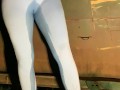 Slut drenches her yoga pants in piss outdoors