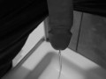 Taking a quick piss on the shower floor, with my semi hard cock